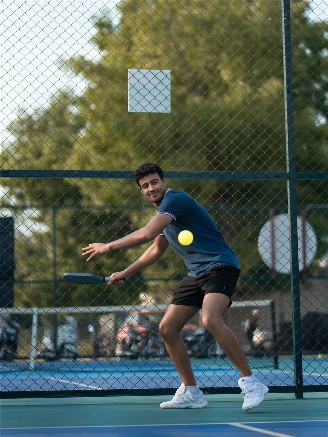 Player striking a forehand